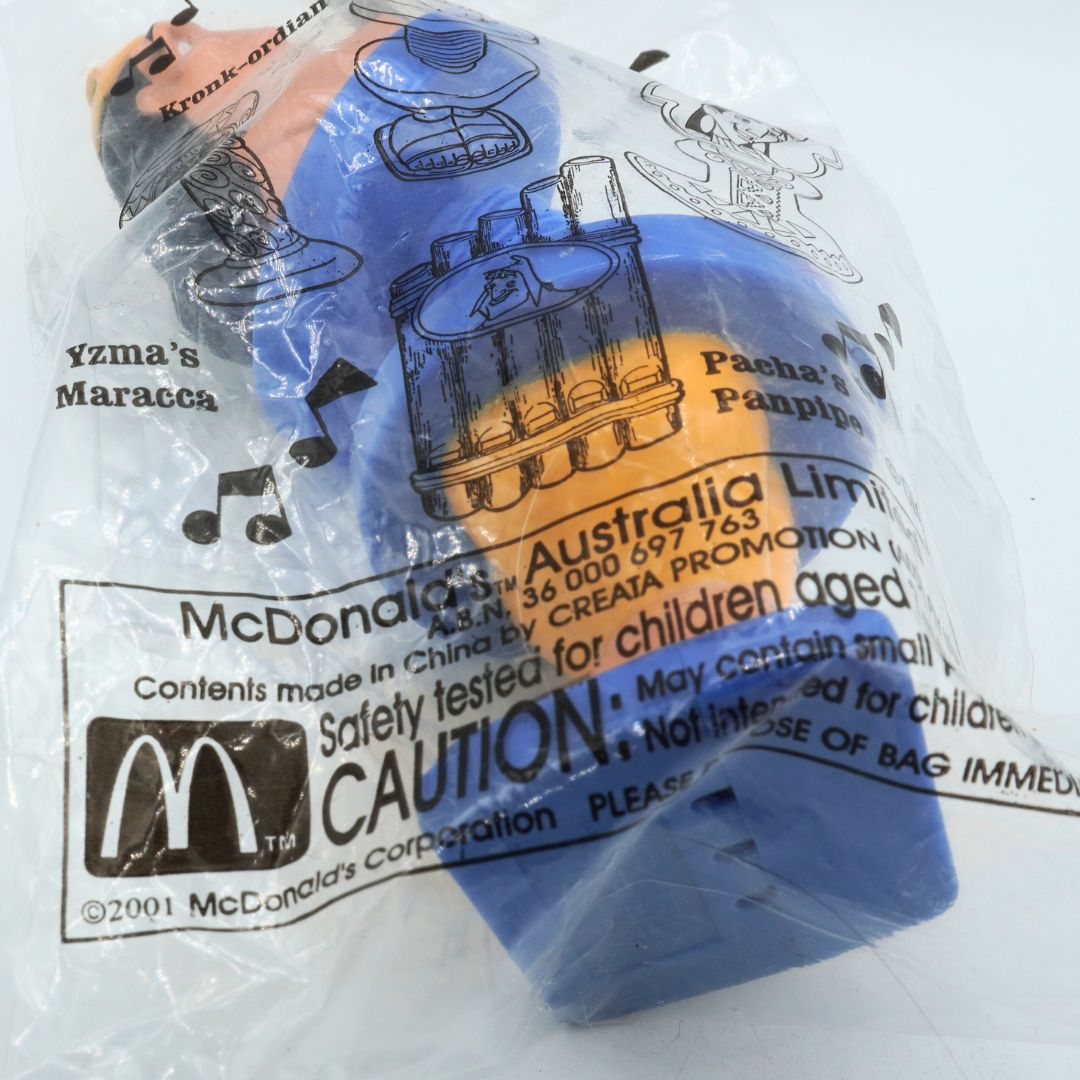 McDonald's toy in packaging with branding and safety information.