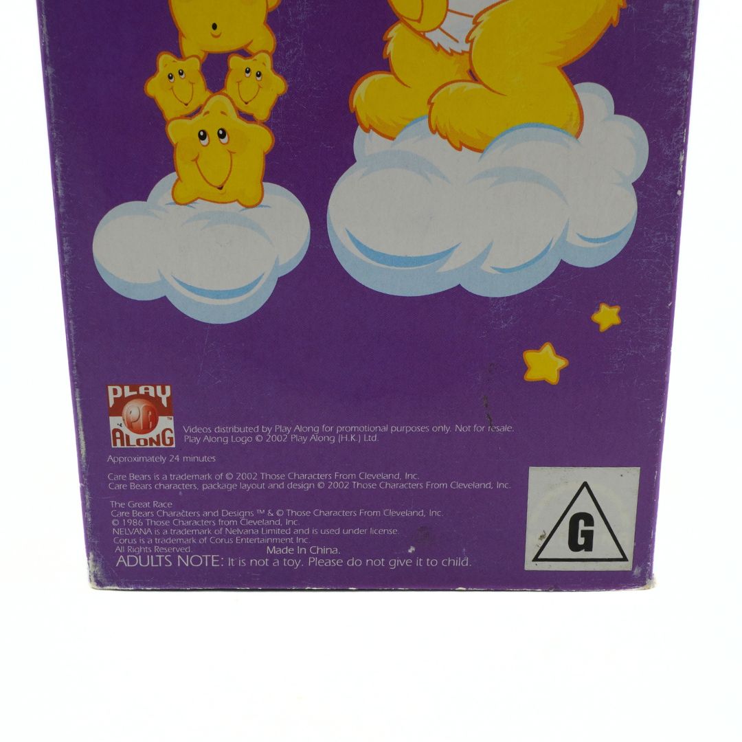Back of a purple box with cartoon characters on a cloud, featuring Play Along logo and warning label.