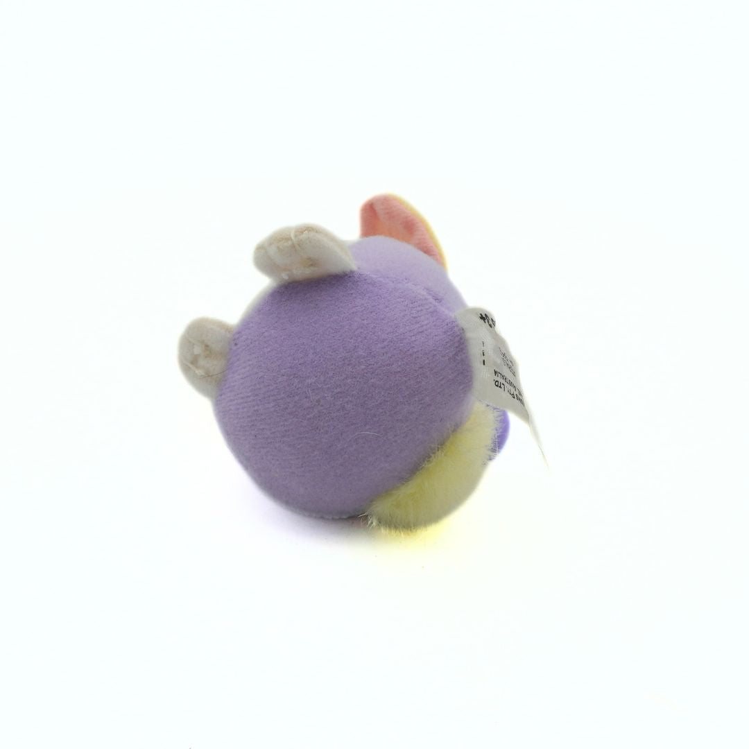 Plush toy with a tag on a white background