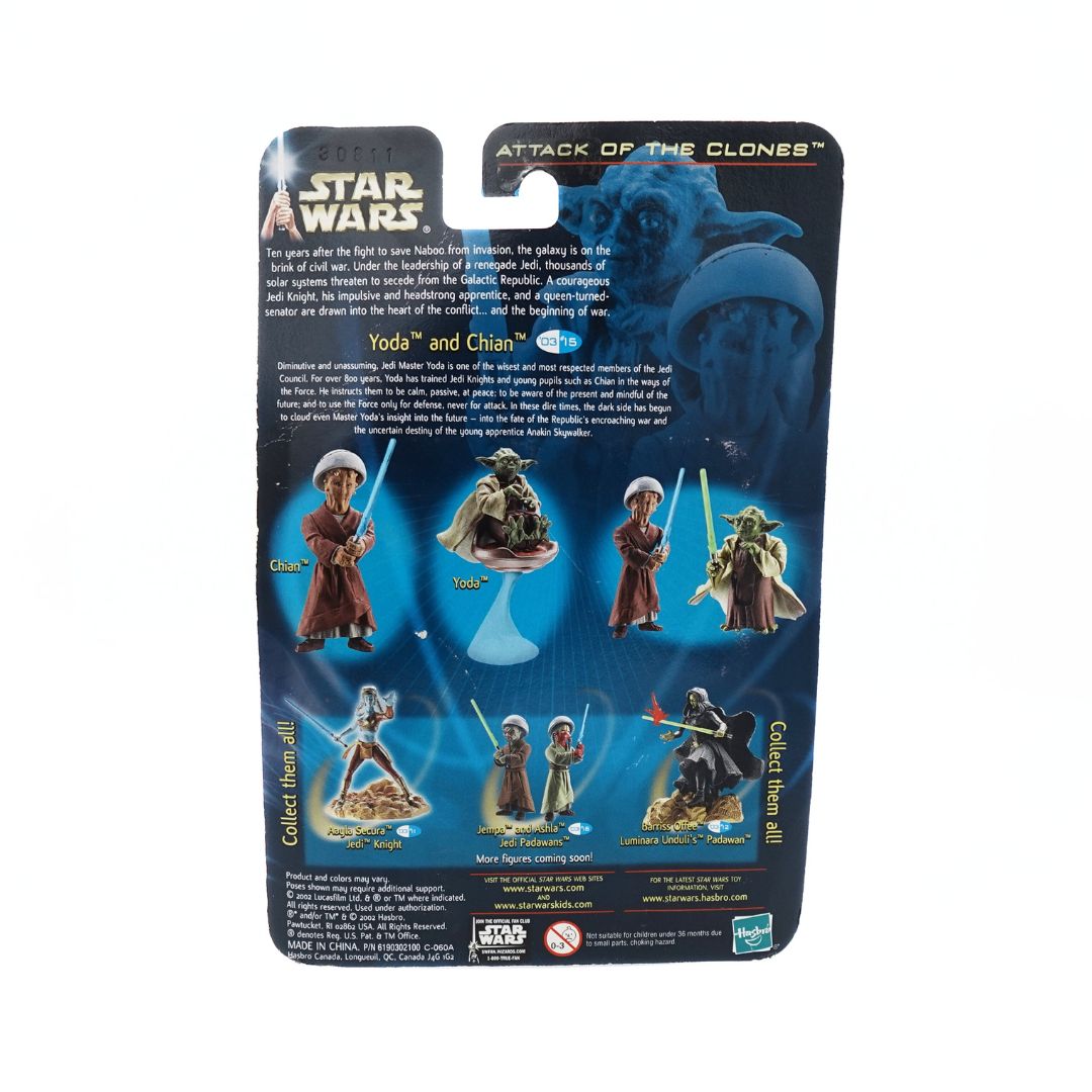 Photo of the back of a 2002 Yoda and Chian figure set, with a green lightsaber, blue lightsaber and brown stick accessories showing the other toys in the collection