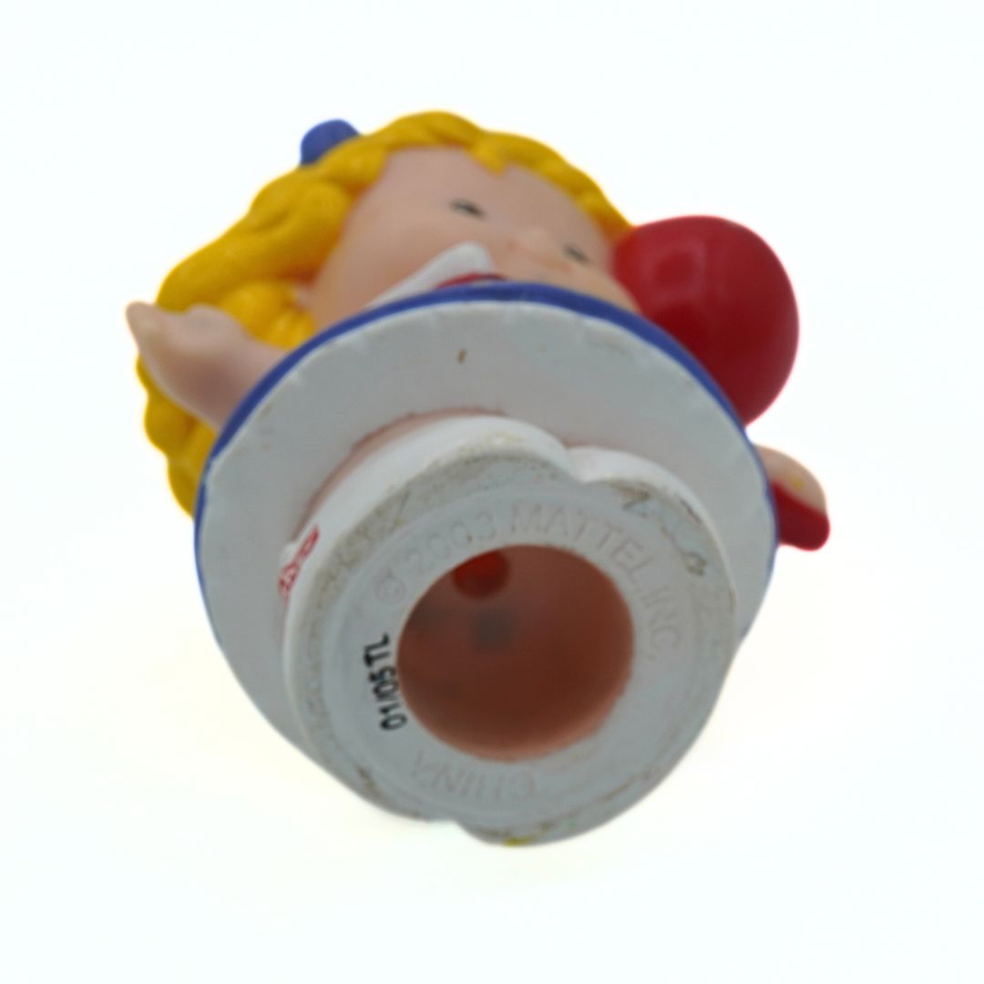 Toy figure with a white container on a white background