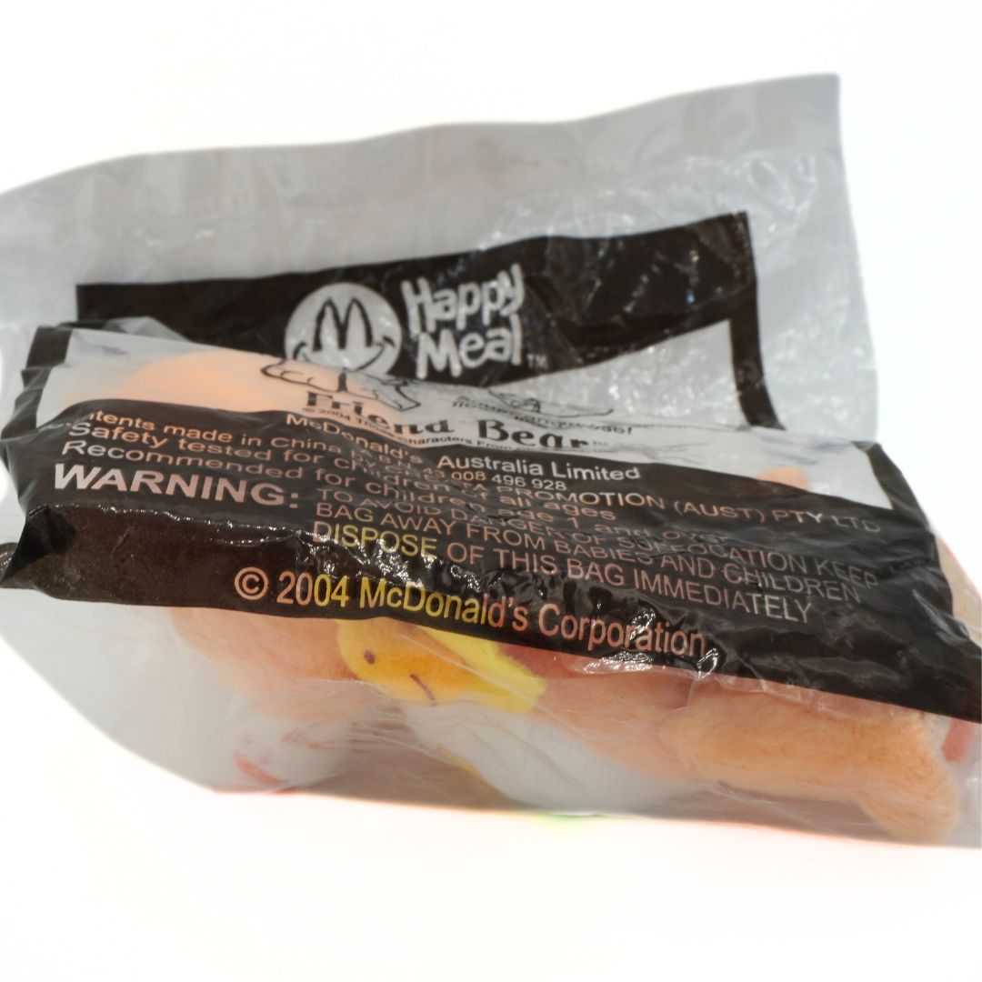 McDonald's Happy Meal toy packaging with warning label on a white background