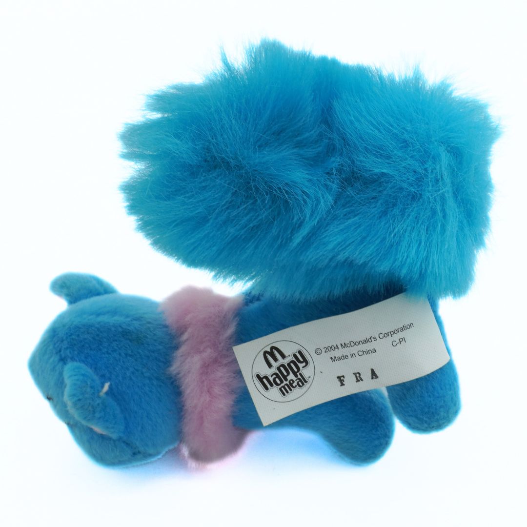 Blue plush toy with pink interior, featuring a Happy Meal label on a white background