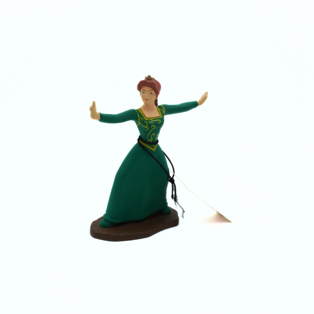 Figurine of a woman in a green dress with a brown base on a white background