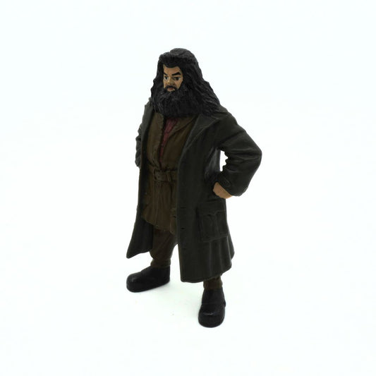 Action figure of a character with long hair and beard wearing a coat on a white background