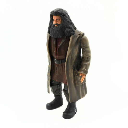 Action figure of a character with long hair and beard wearing a coat on a white background