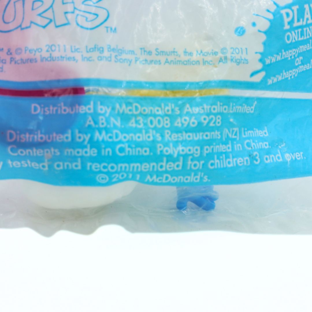 Close-up of a McDonald's Happy Meal toy packaging with text and branding.