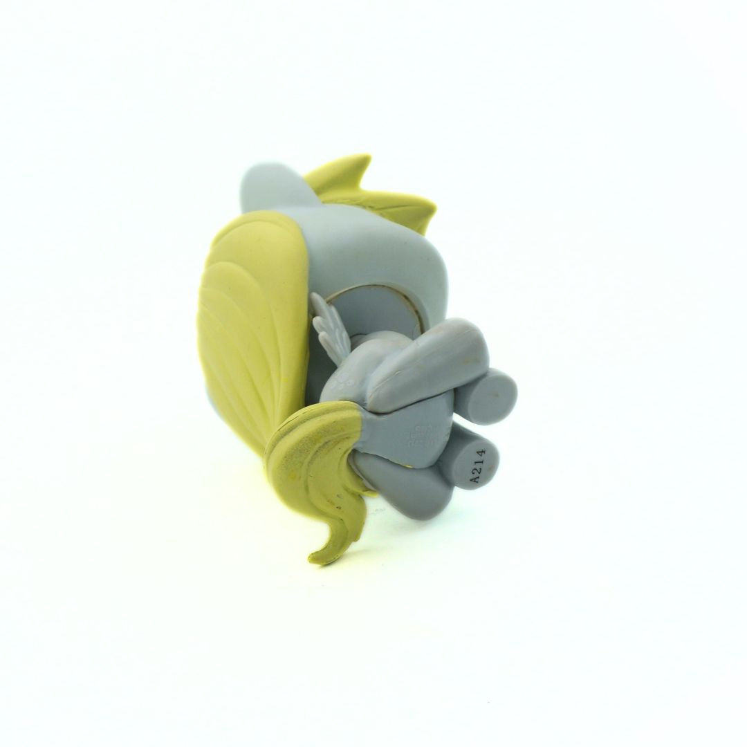 Gray and yellow toy pony on a white background