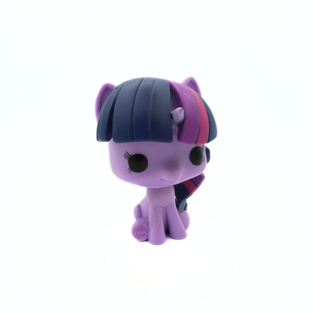 Purple toy pony with a blue mane on a white background