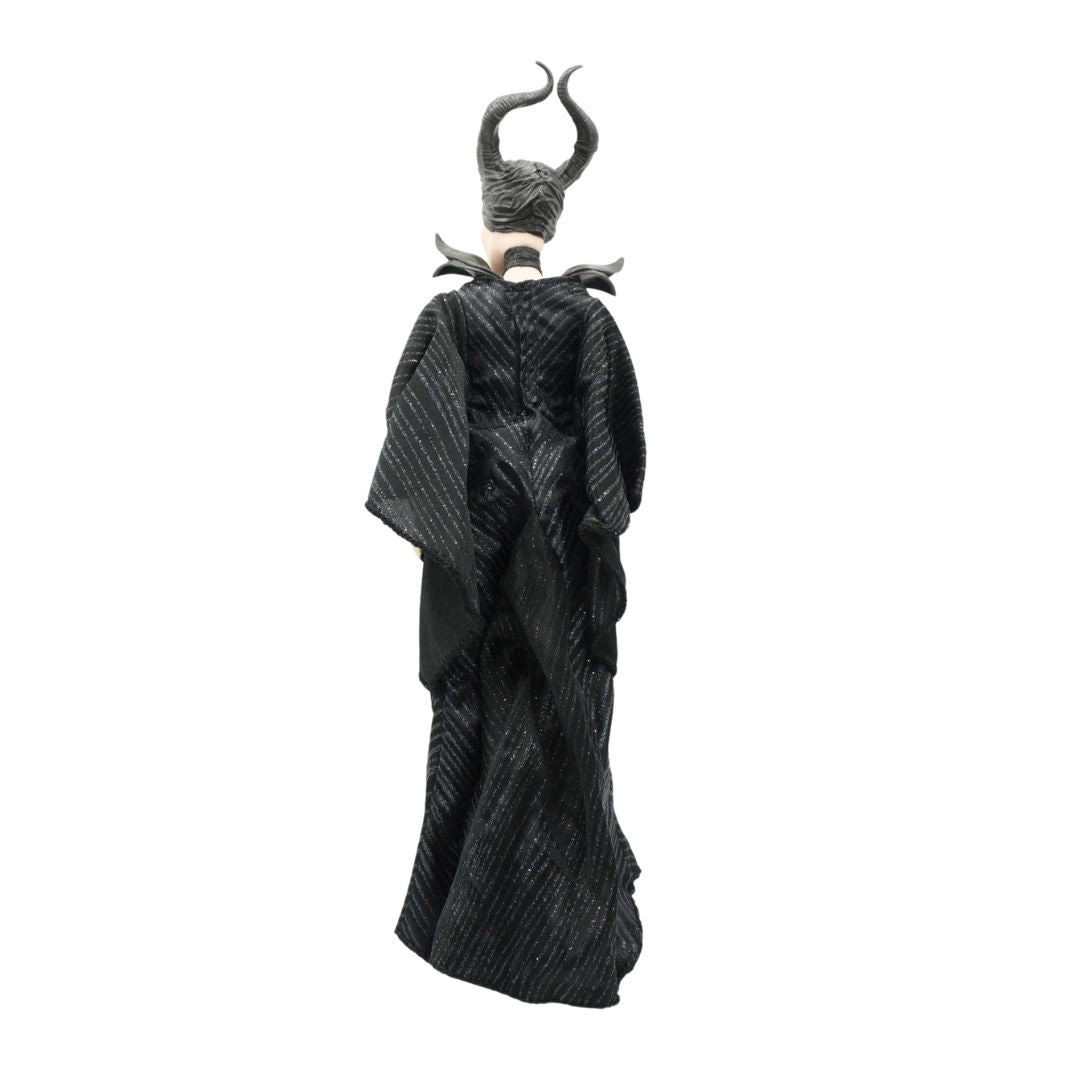 Front on image of Maleficent wearing a black dress and with a hat with horns