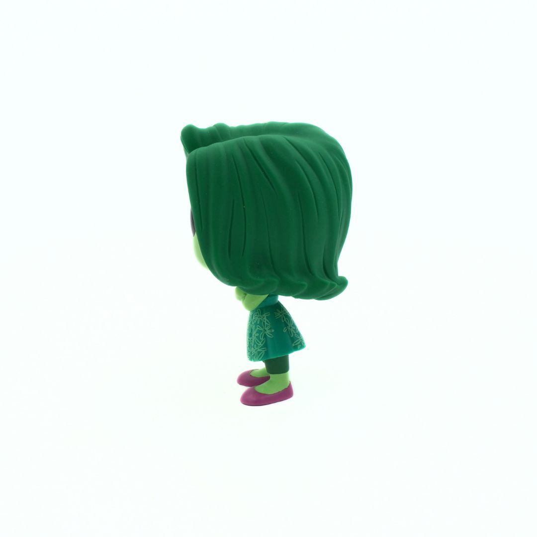 Side on photo of a green and pink Pop Vinyl figurine of Disgust from the movie Inside Out