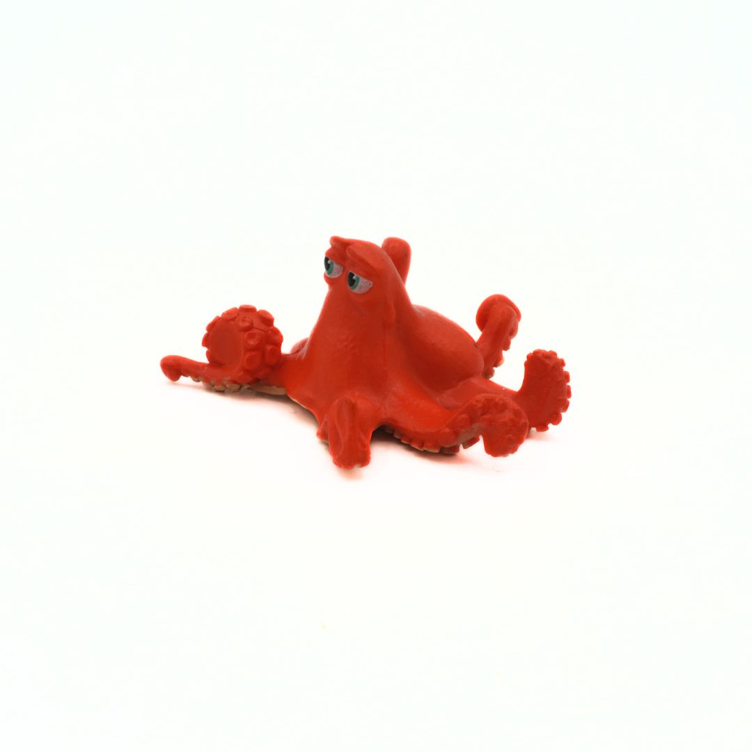 Red octopus toy on a white background