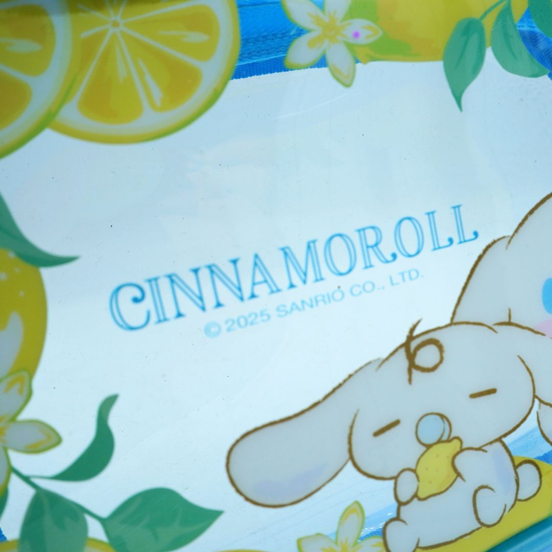 A blue and yellow lemon themed plastic pouch with Cinnamoroll, photographed against a white background