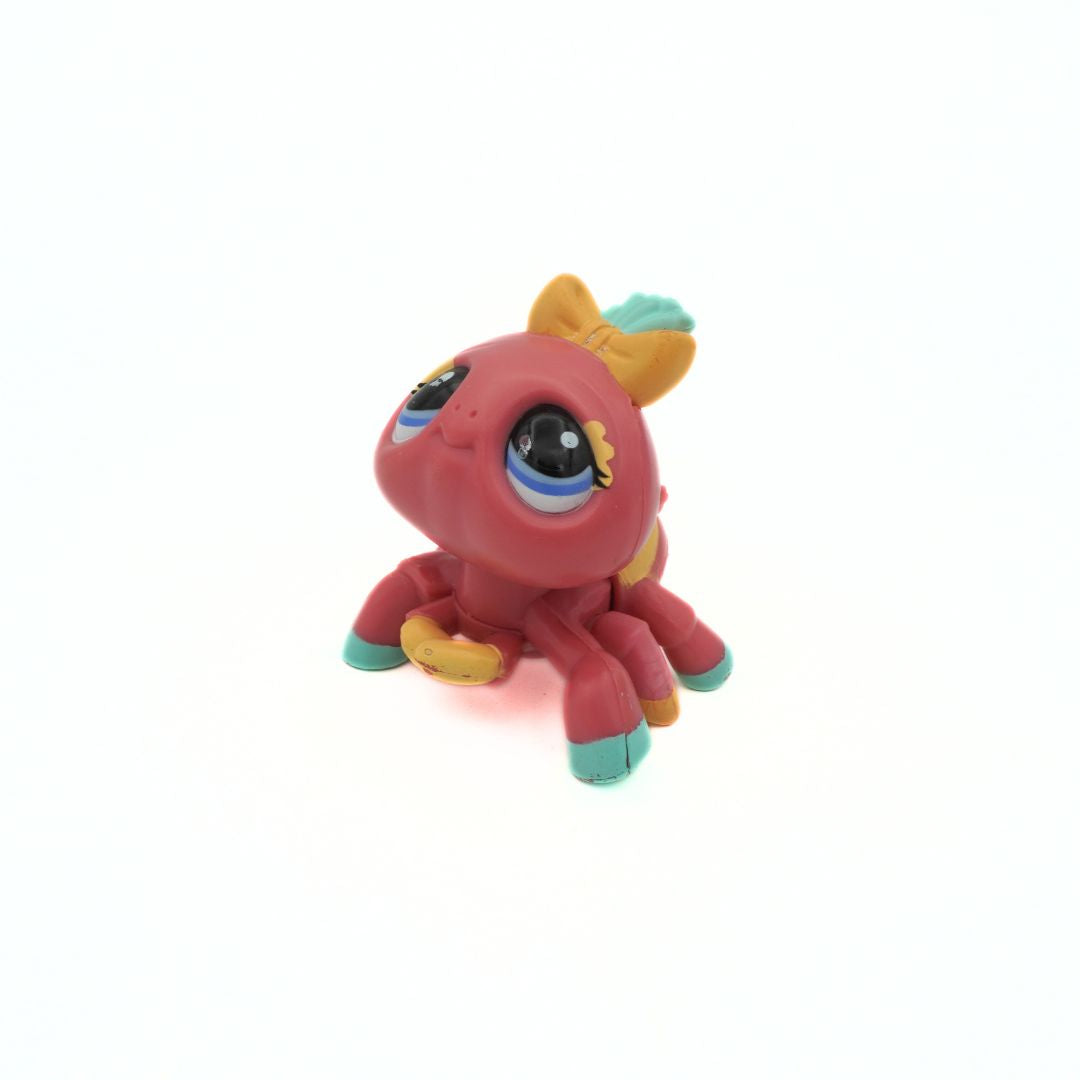 Pink Spider released by Littlest Pet Shop with a yellow bow