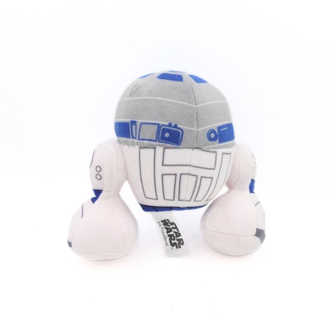 The back of a modern R2D2 plush with big legs