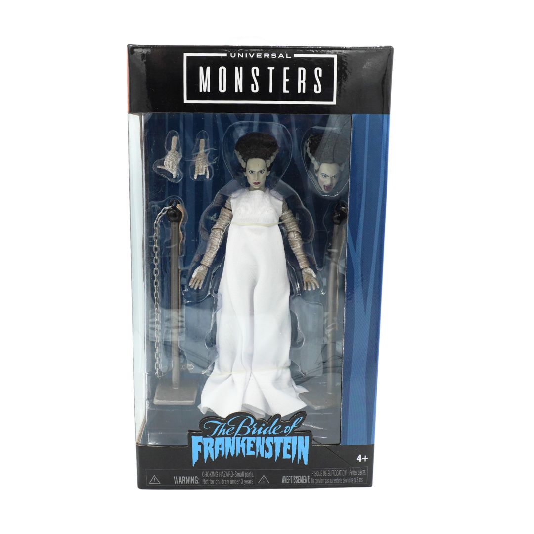 Universal Monsters The Bride of Frankenstein action figure in its original window box packaging, featuring a white gown figure with interchangeable heads and accessories.