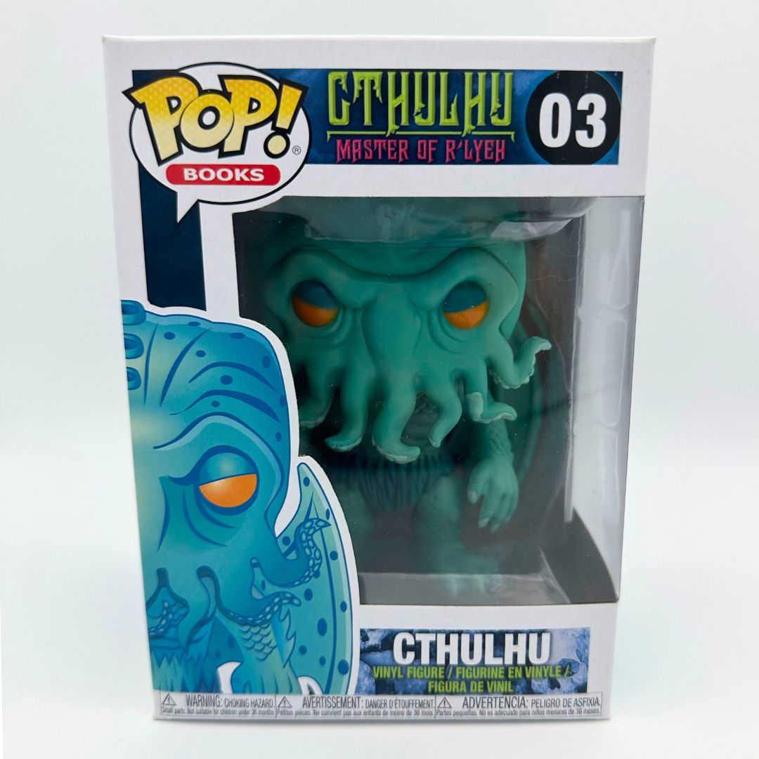 A front on photograph of the Pop Vinyl Cthulhu Funko Pop 03 inside its box
