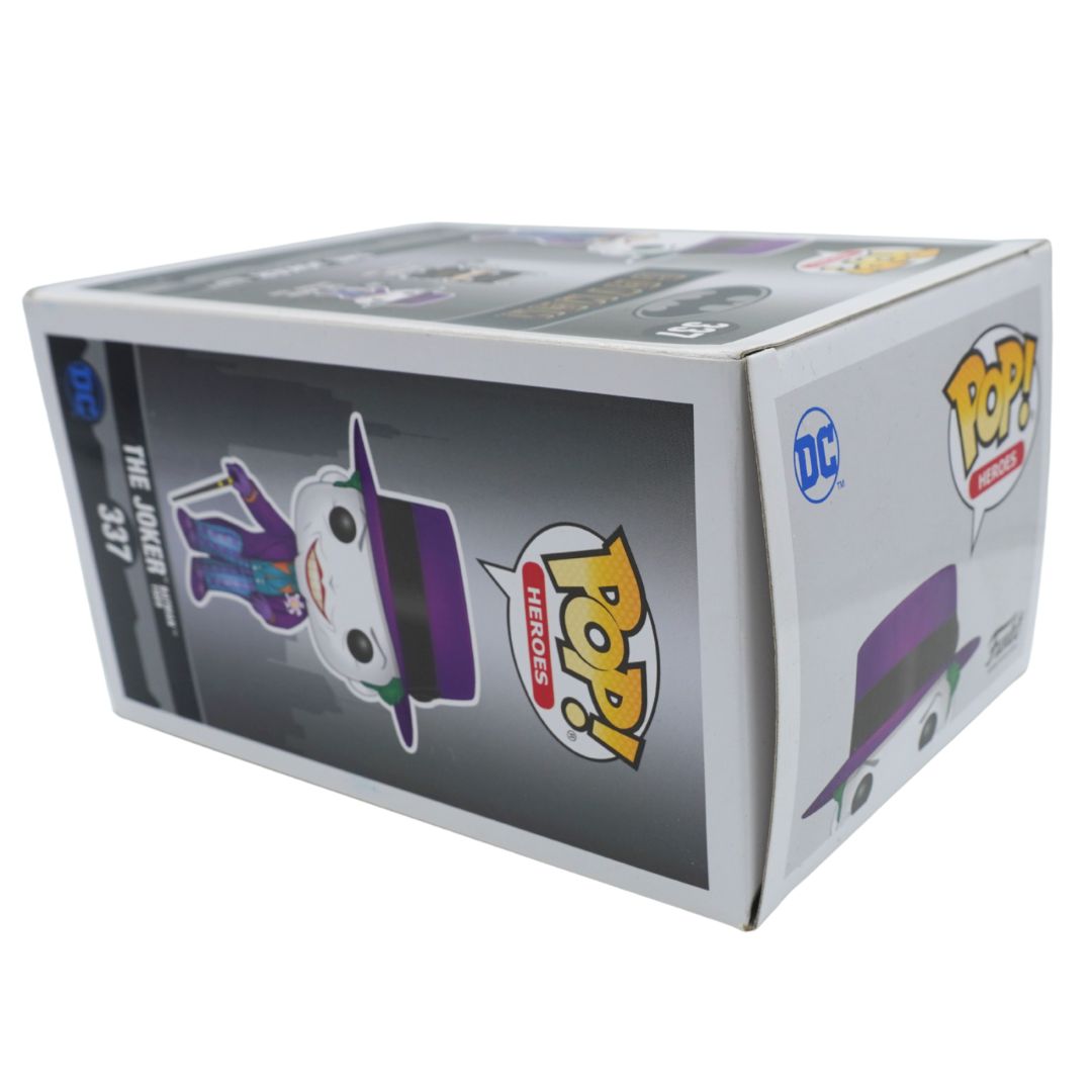 Funko Pop! Heroes The Joker #337 vinyl figure blind box, featuring the DC Comics logo and Funko Pop! branding on a white background.