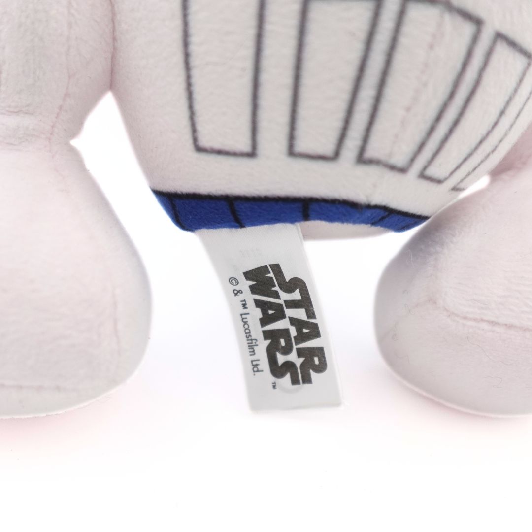 A close up photo of a Star Wars product tag on a plush toy