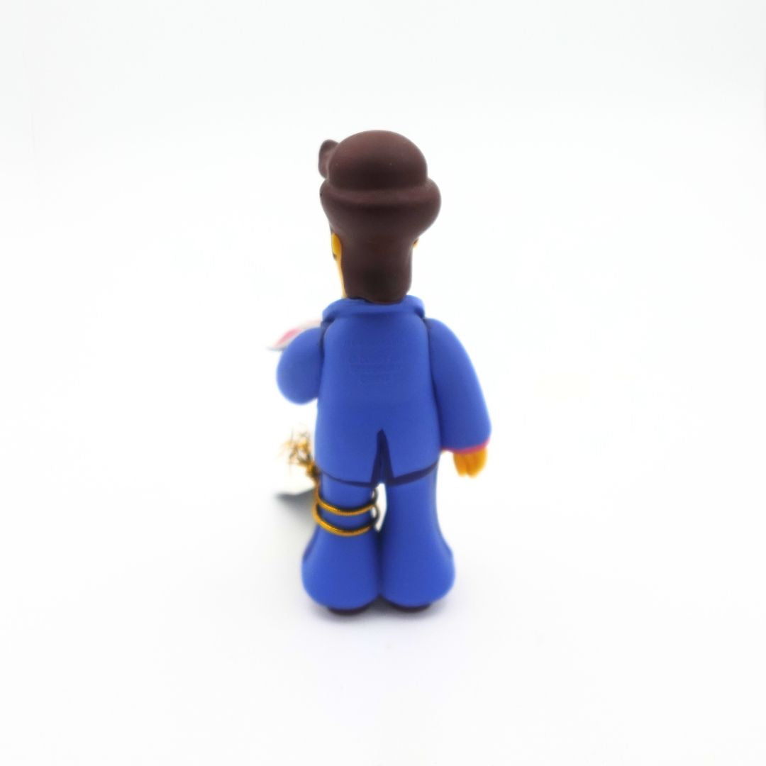 The back of a young Homer Simpson figure wearing a blue suit.