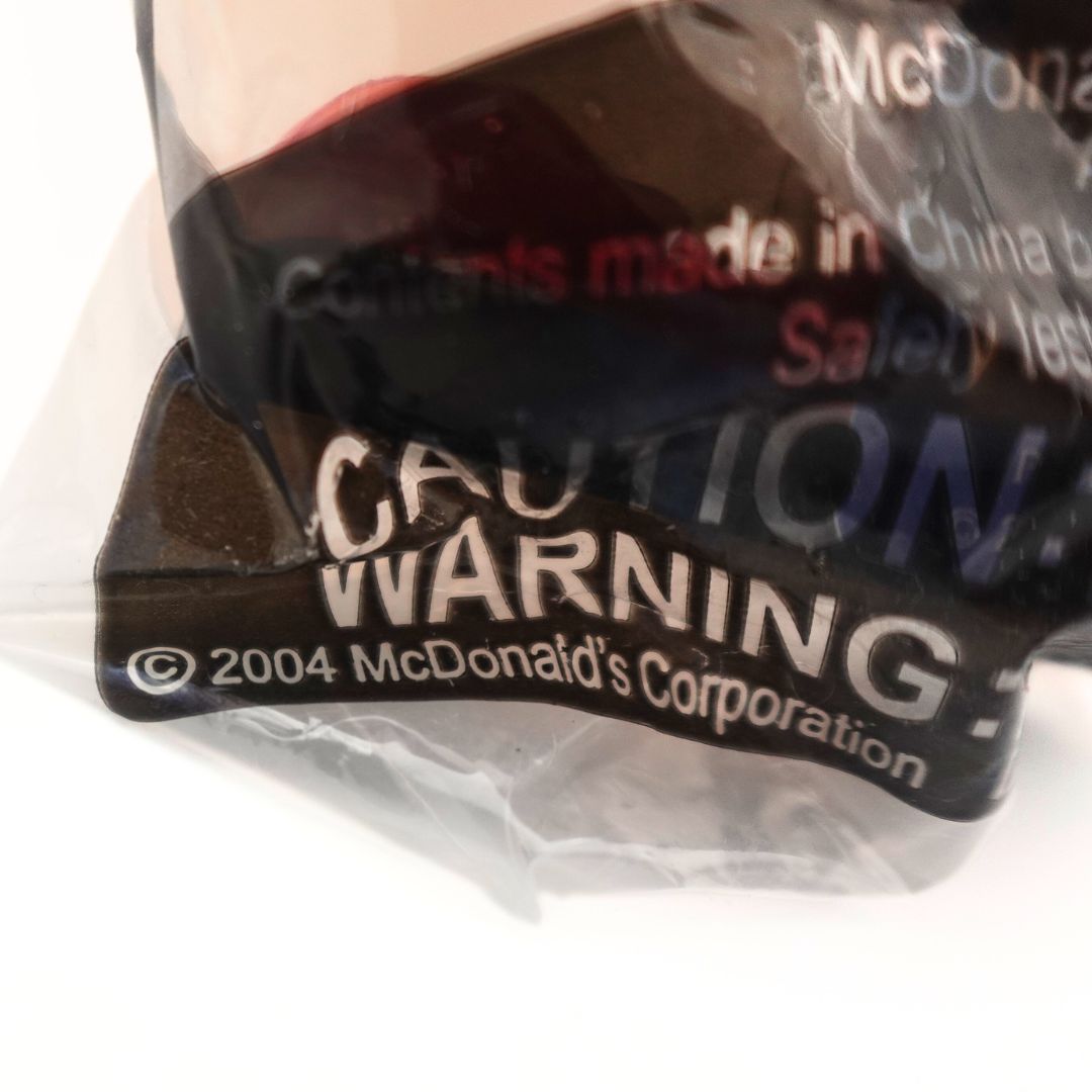 Close up of Mcdonalds Happy Meal 2004 toy packaging