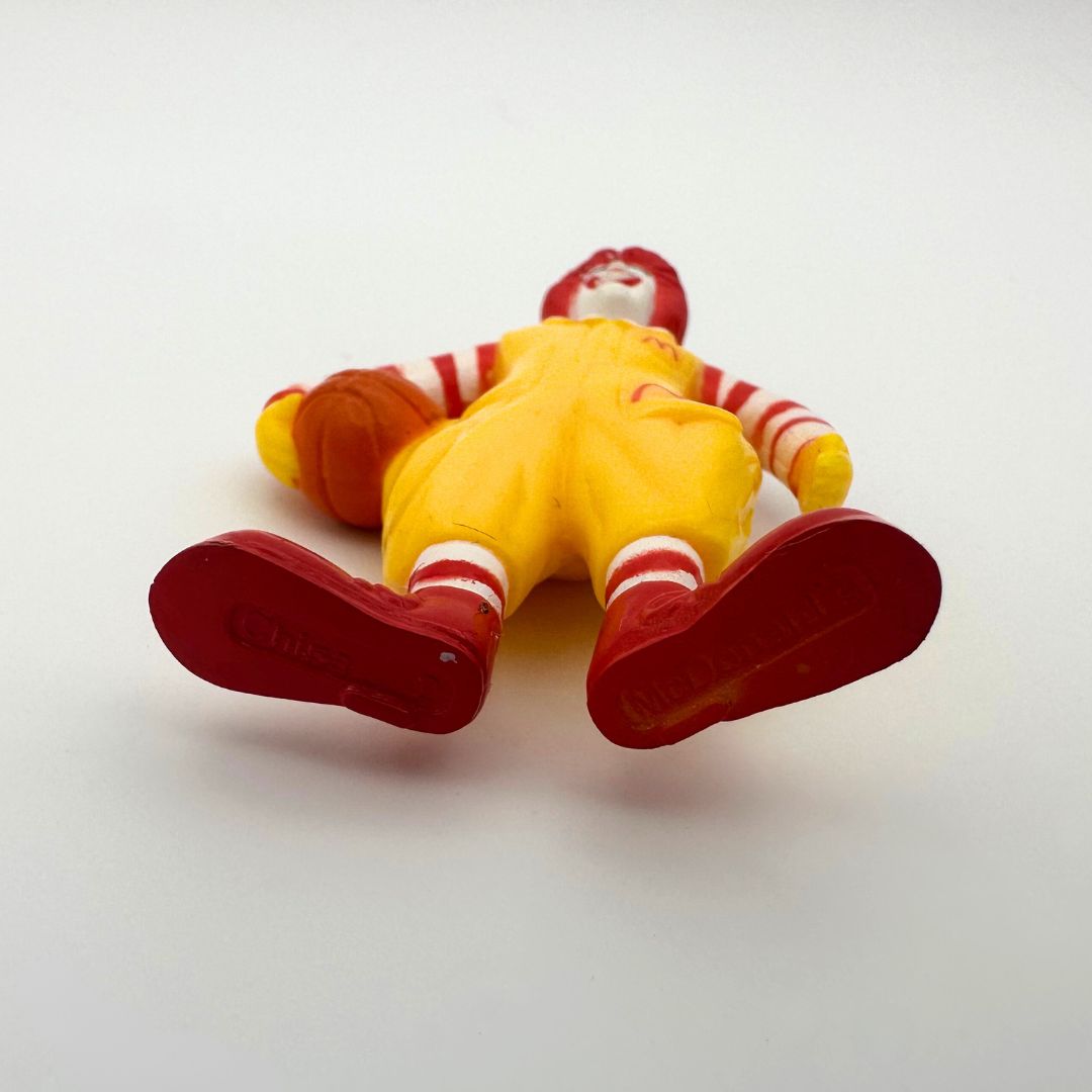 Vintage Ronald McDonald figure with basketball