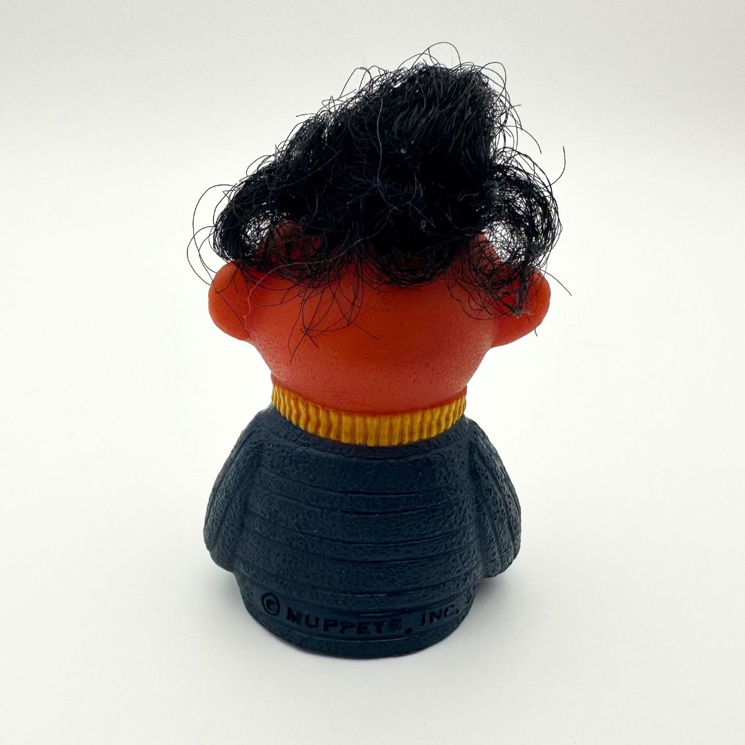 The back side of a vintage Sesame Street Ernie finger puppet