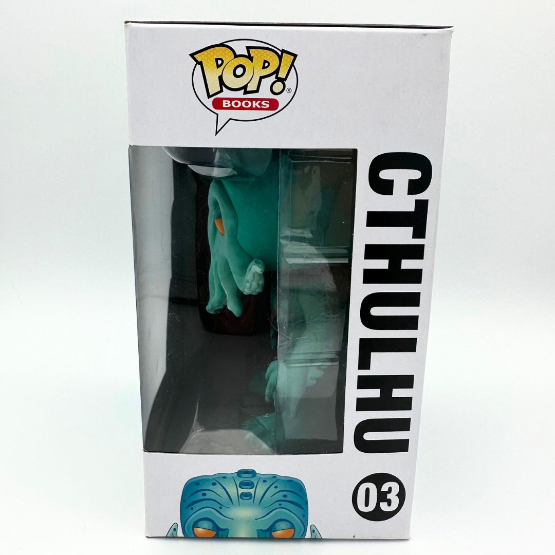 A side on photograph of the Cthulhu 03 Funko Pop with the figure visible inside the plastic bubble