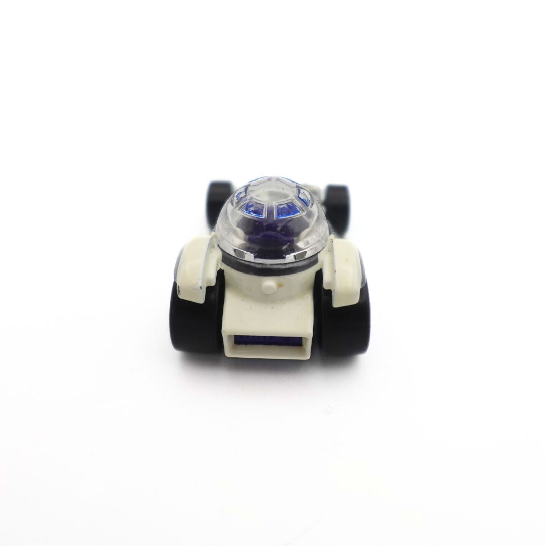 The back of a Star Wars R2D2 Matchbox car, with a white body and black wheels