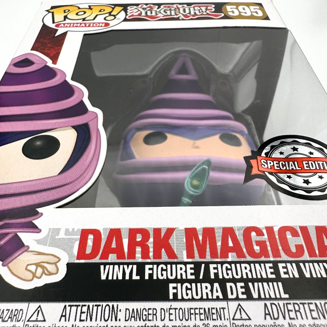 A close up photo of the Yu-Gi-Oh Dark Magician 595 boxed Funko Pop with a special edition sticker