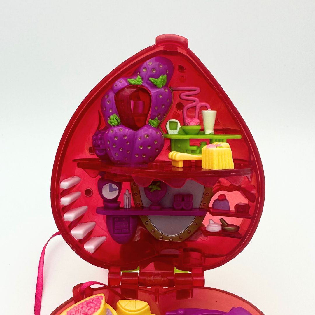The top half of the 90s Polly Pocket Strawberry playset