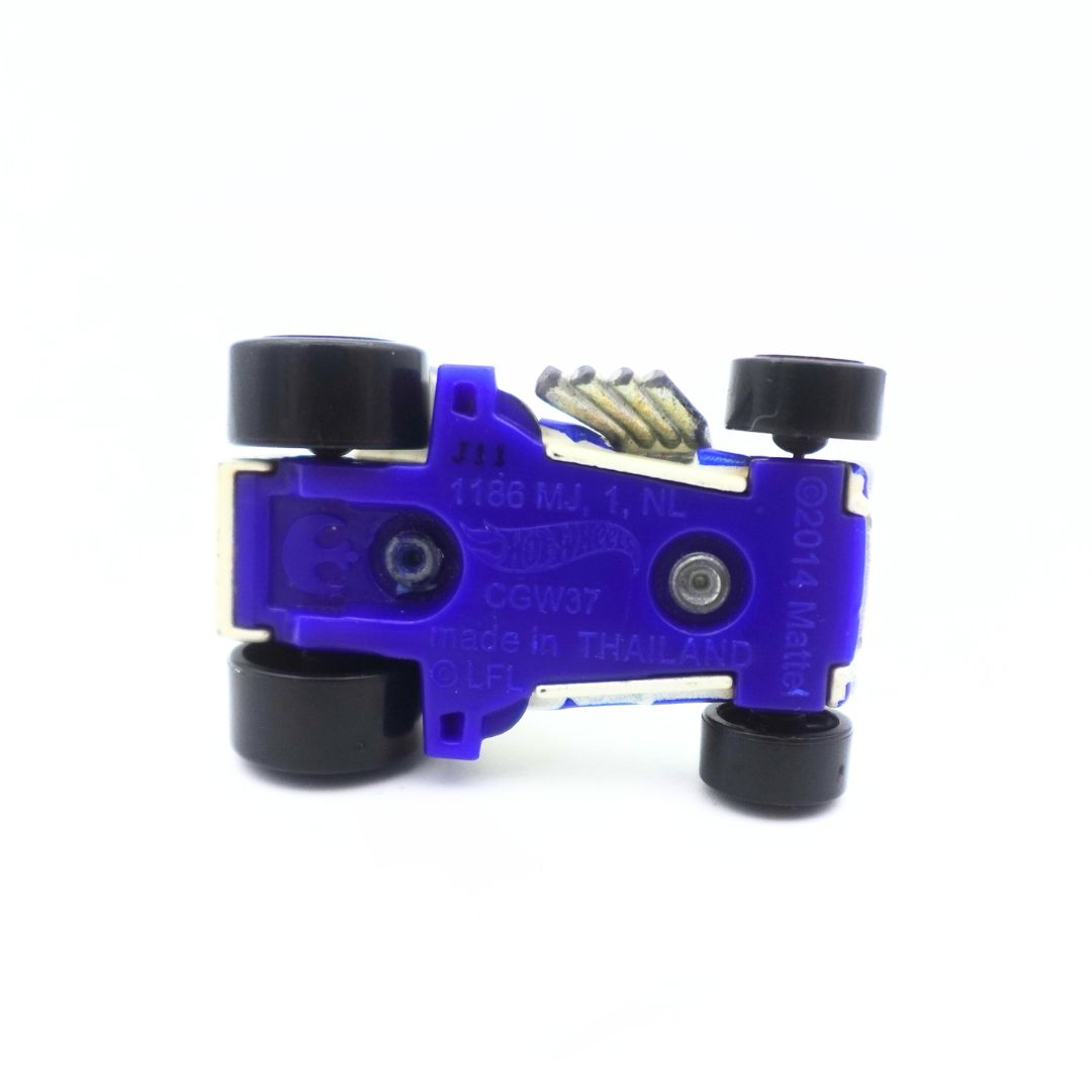 The underside of an R2D2 Matchbox car, with a blue bottom and black wheels