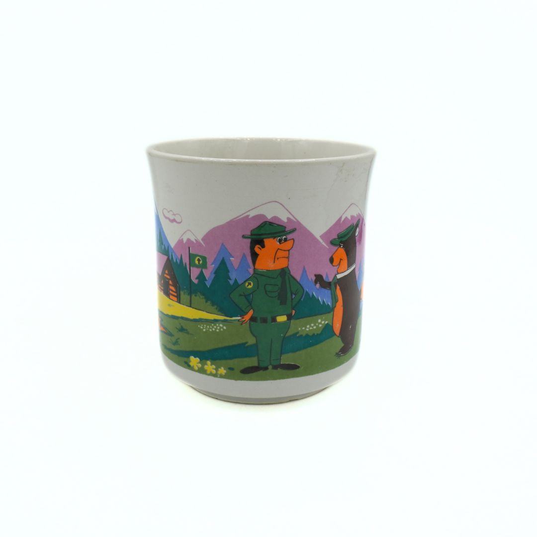 Ceramic mug with a nature-themed design featuring a person and a fox in a forest setting.