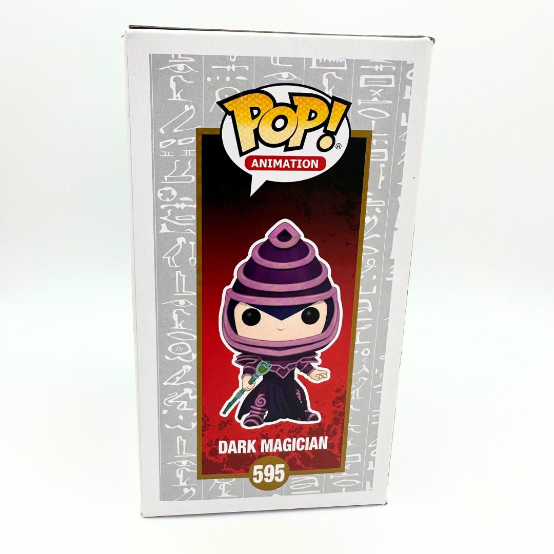 A side on photo of the Dark Magician 595 Funko Pop featuring an illustration of the Yu-Gi-Oh character and Pop Vinyl branding
