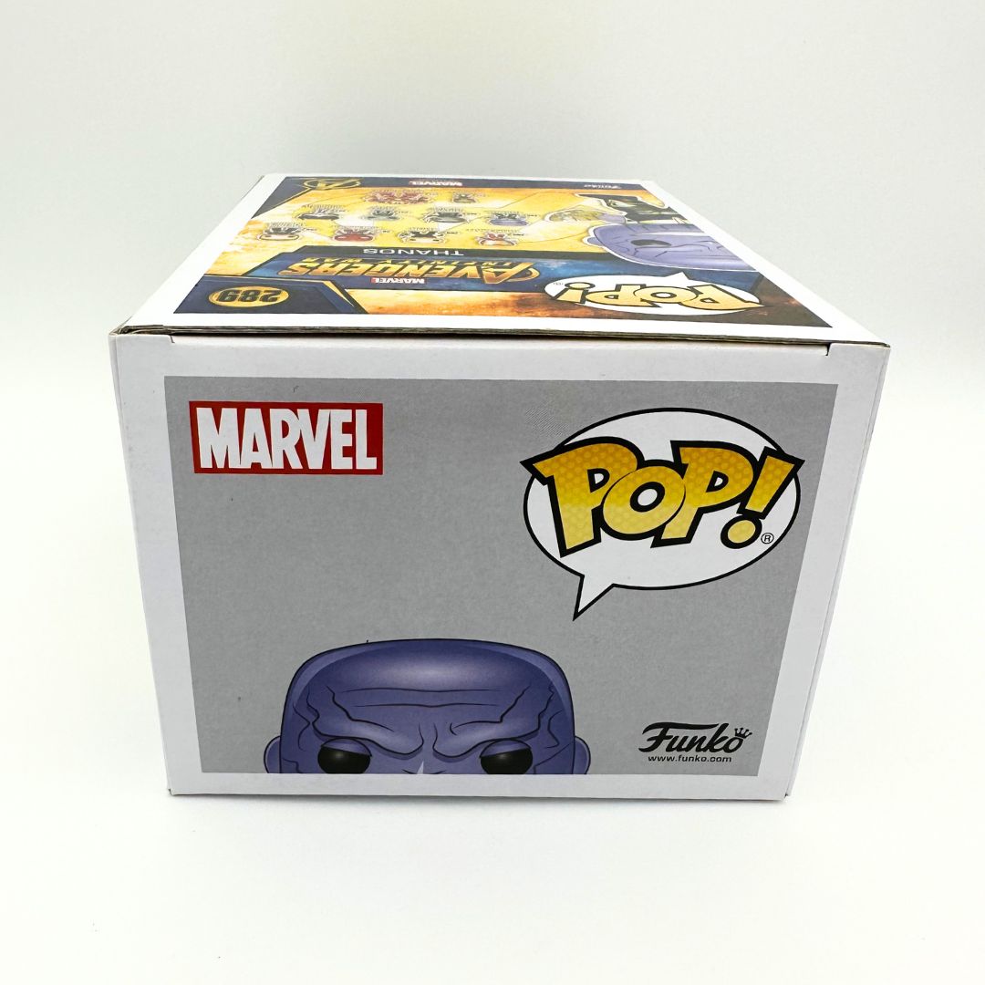 A photo of the top of the 289 Thanos Funko Pop featuring Marvel and Pop Vinyl branding