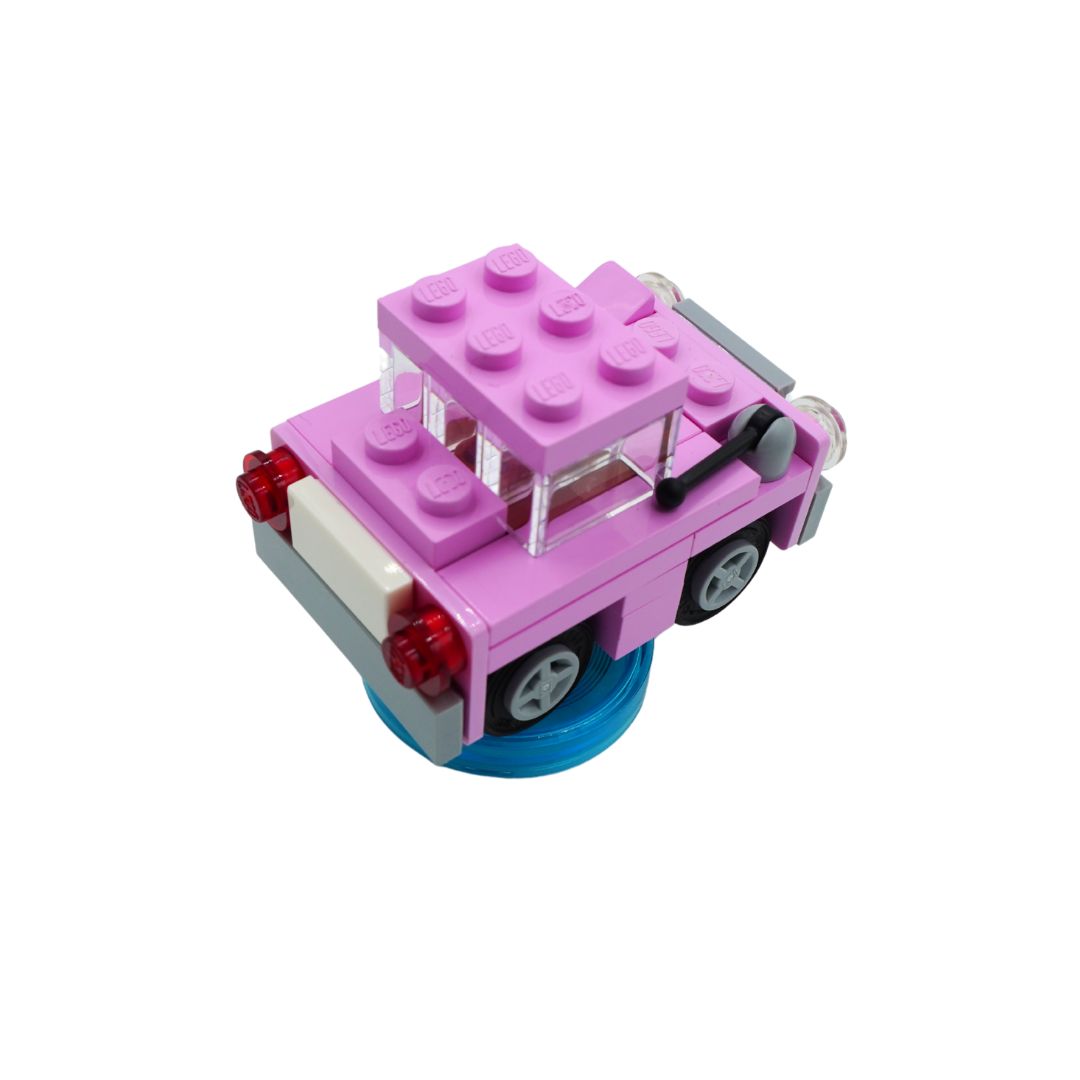 A pink toy brick car with a transparent roof, gray wheels, red taillights, and a blue base, shown on a plain white background.