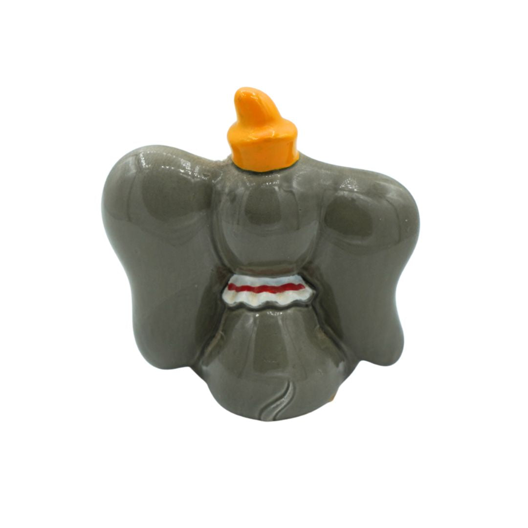 A novelty elephant-shaped container or figurine in matte gray with a bright orange top and a small white and red detail at the waist, shown on a plain white background.