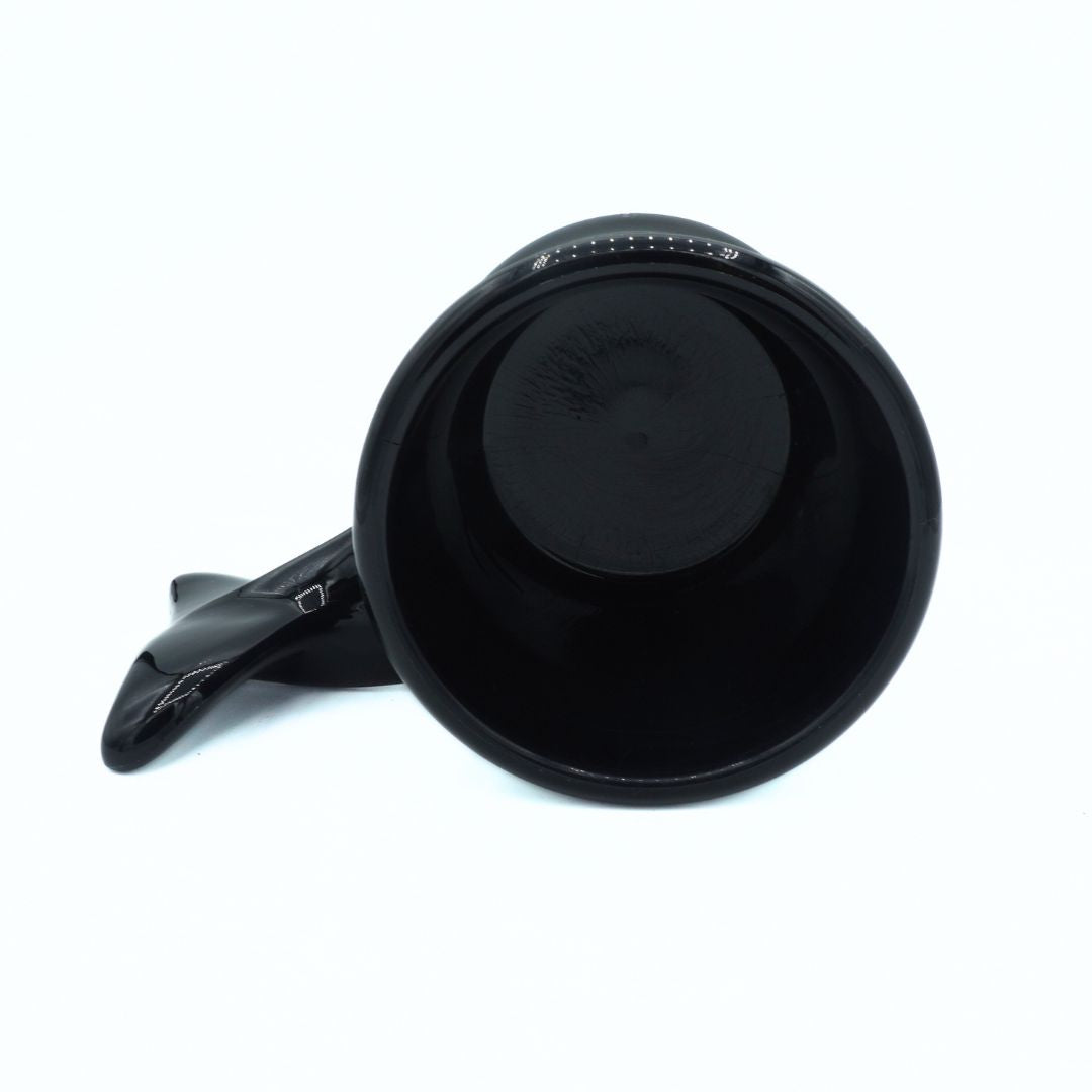 Black travel mug with a handle on a white background