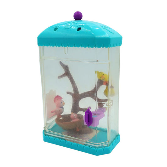 A blue 1994 Littlest Pet Shop bird display with brown tree details