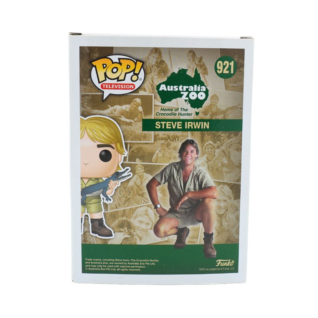 Back of a Steve Irwin Funko Pop, with a green and brown colour palette photographed against a white background