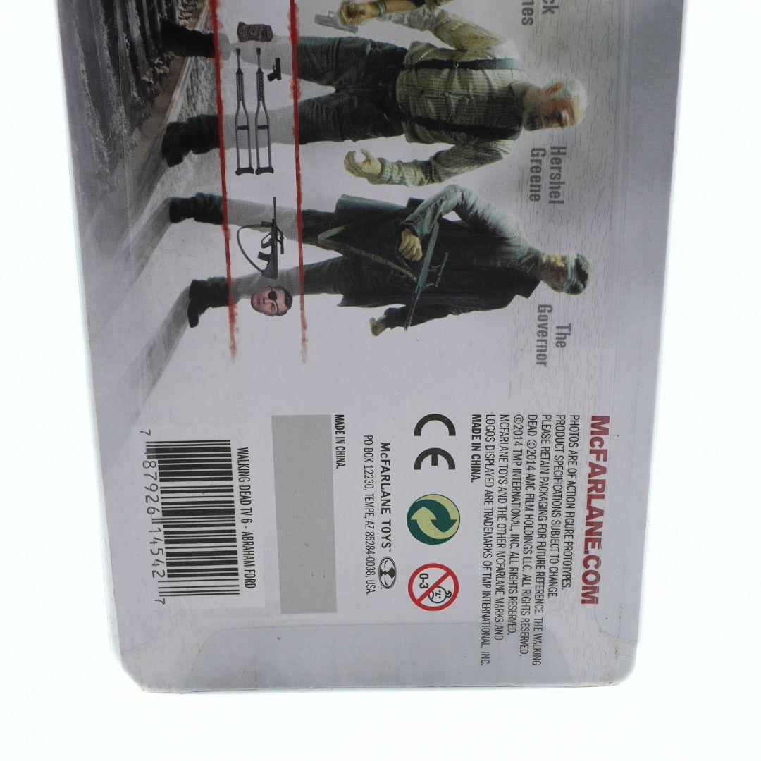 Back of a toy figure packaging with characters and branding details.