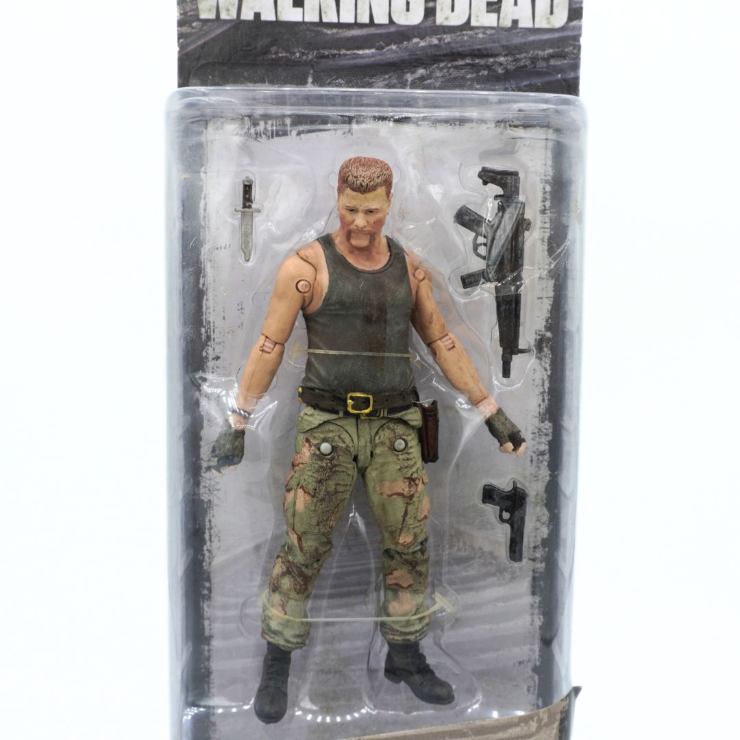 Action figure in packaging with 'The Walking Dead' branding