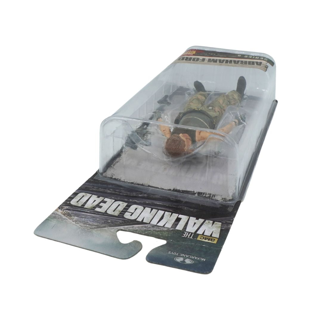 Action figure in packaging with 'The Walking Dead' branding on a white background