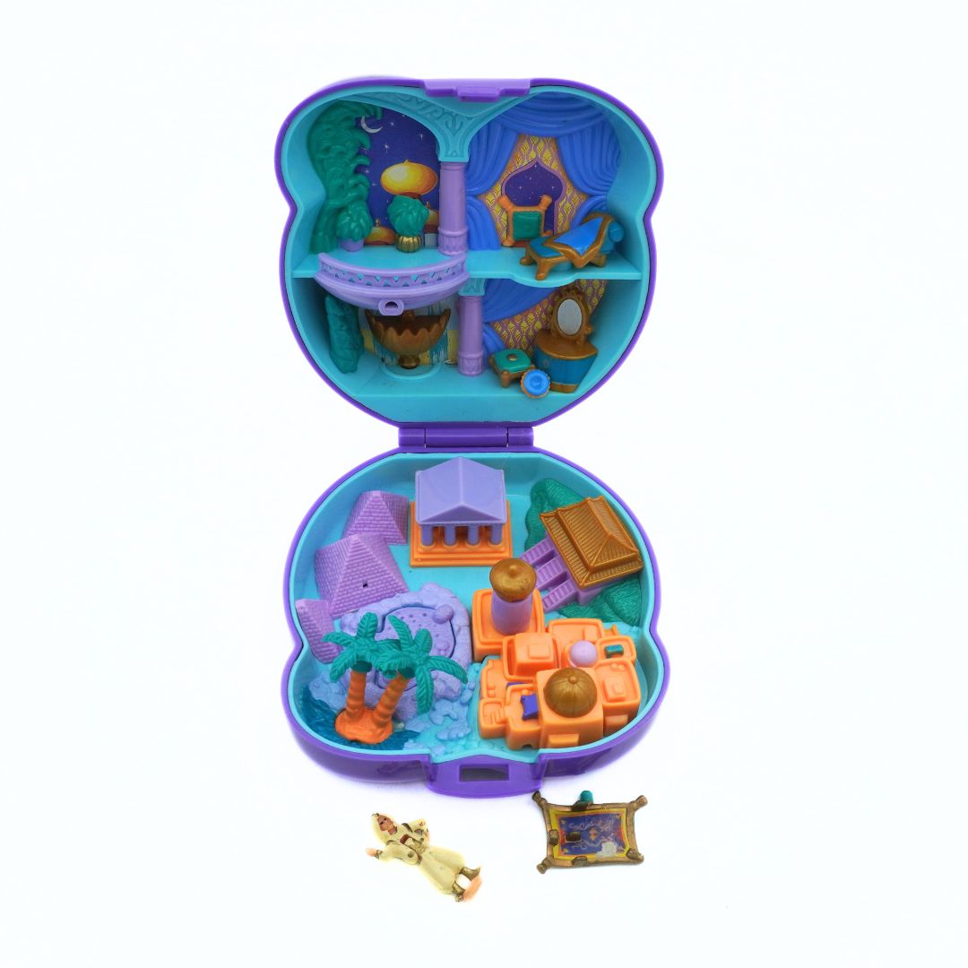 Toy set with various miniature buildings and accessories in a colorful case on a white background