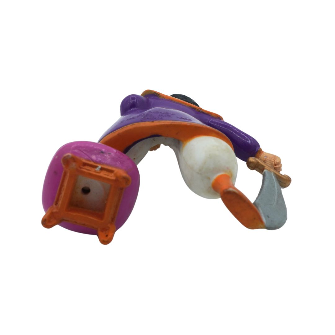 Toy figure of a character with purple and orange elements on a white background