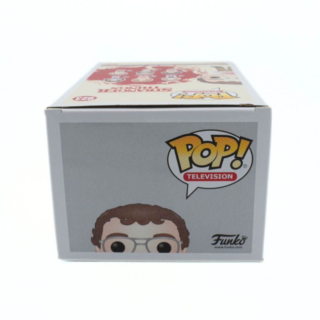 Top down image of an Alexei Funko Pop in a grey and white box