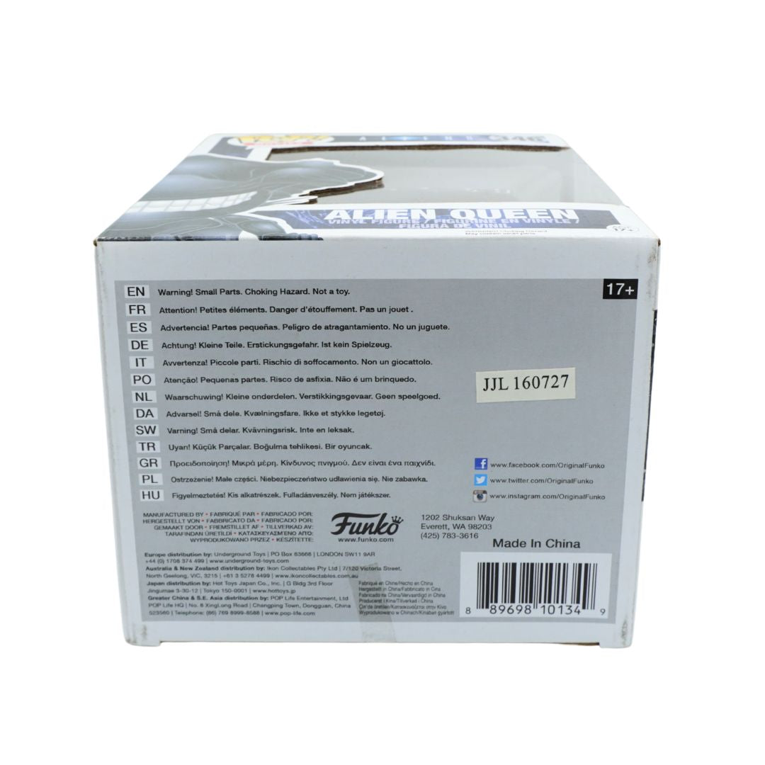 The underside of an Alien Queen Funko Pop box, showing product warning text, a barcode, and a white sticker with the code J3L160727 on a white background.
