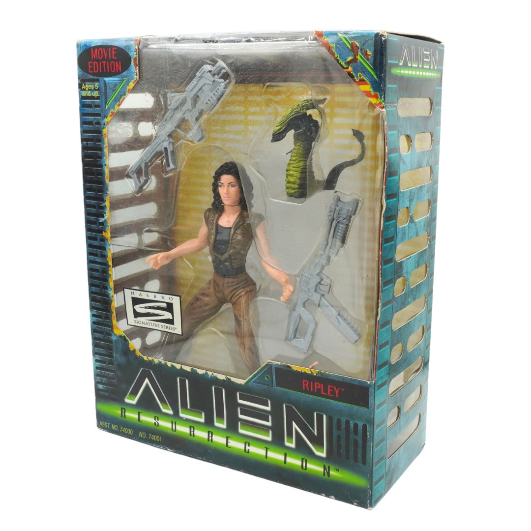 Action figure packaging featuring a character with weapons, labeled 'Alien' and 'Ripley'.