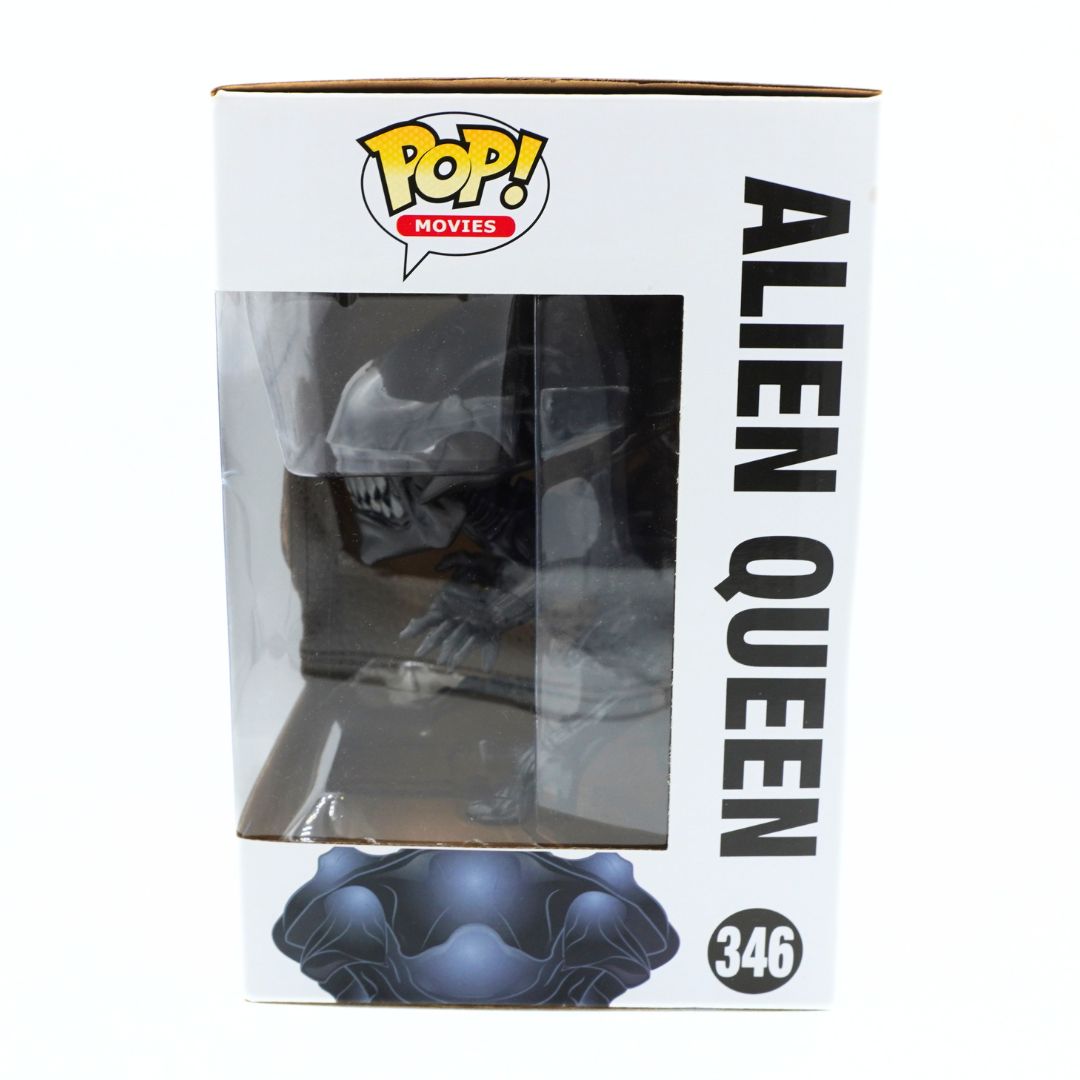 Funko Pop! Movies Alien Queen collectible figure in its original window box packaging, featuring the black and blue Alien Queen figure visible through a clear plastic window on a white box with black text.