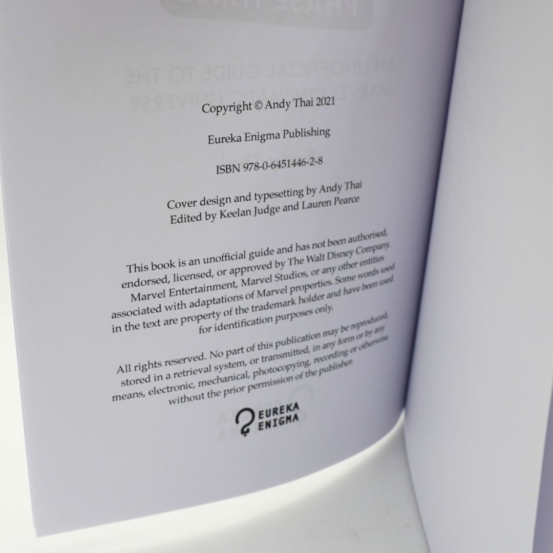 An open book showing the copyright page with text from Eureka Enigma Publishing and Marvel Entertainment on white pages.
